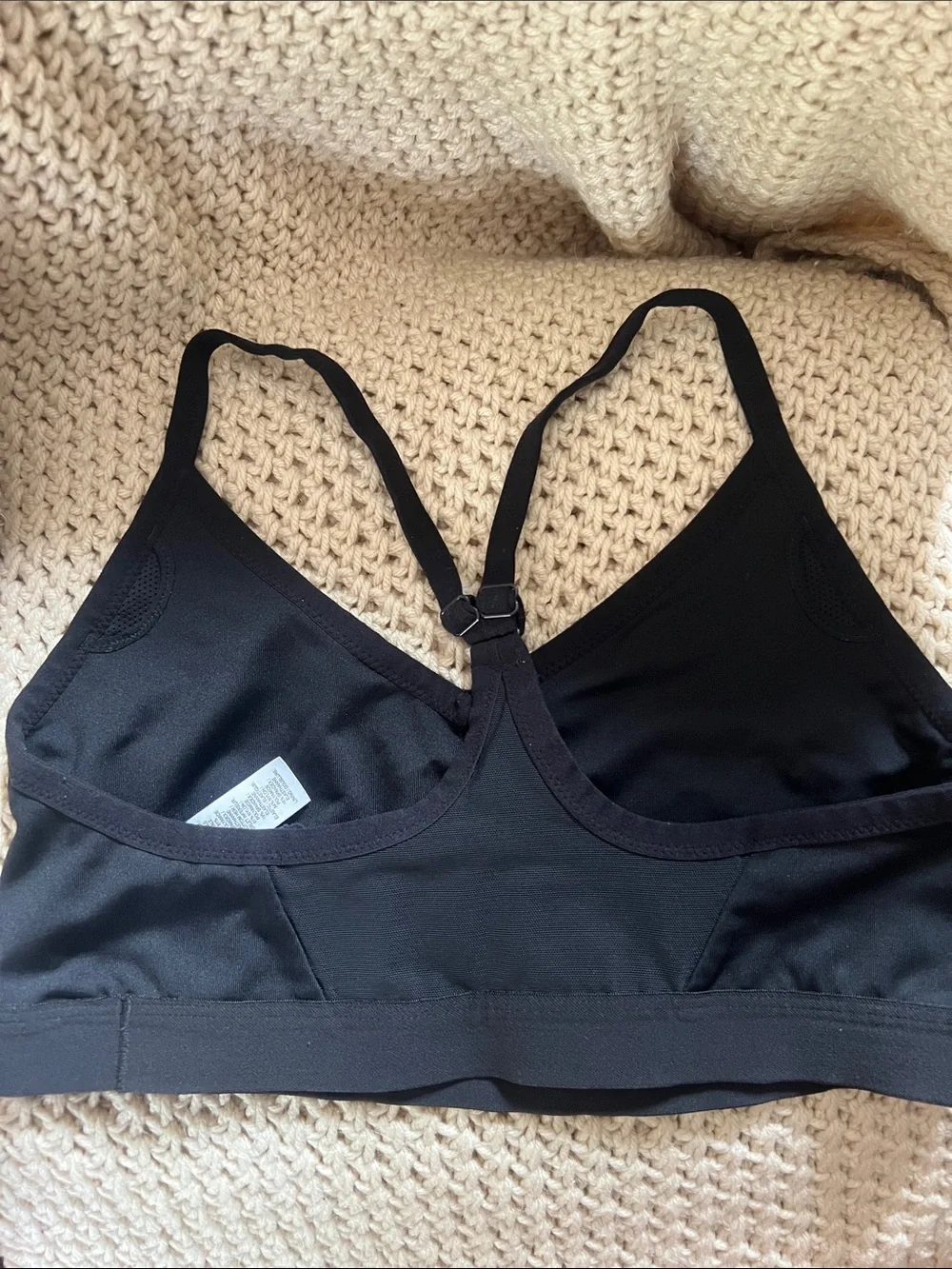 Nike Black Sports Bra with White Swoosh and Adjustable Crisscross Straps